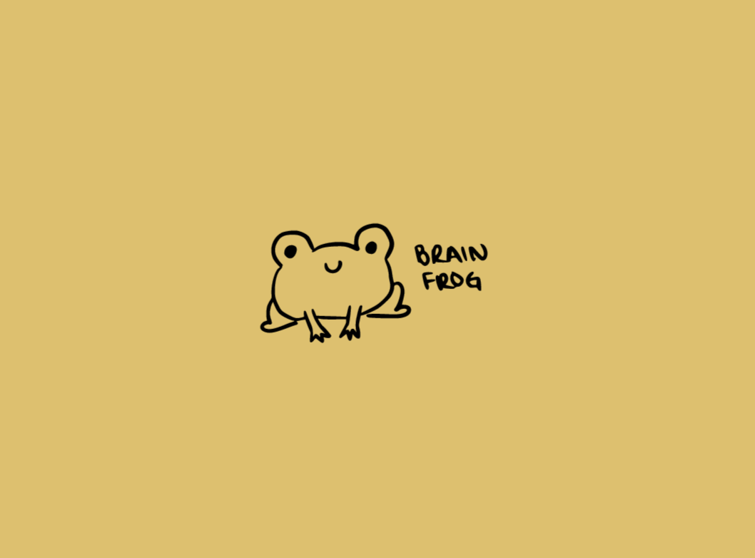 A yellow notebook with a simple black line drawing of a cute little frog on the cover with the words 'Brain frog'.