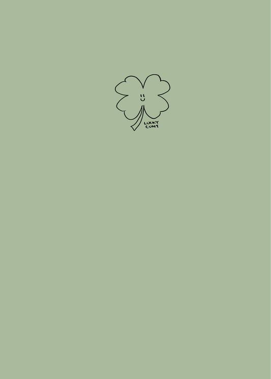 Notebook cover with a soft green colour, a minimalist image of a cute smiling four leaf clover with the words 'lucky cunt'.