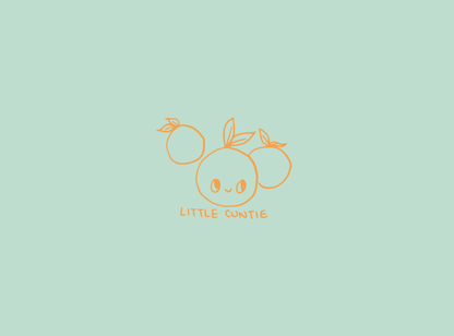 soft green cover of notebook, with 3 little oranges, one with a cute smiling face with the words below 'little cuntie'